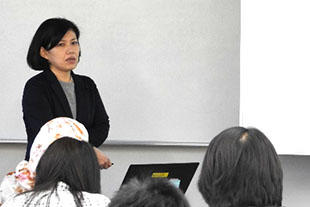 Ms. Teshima giving a speech