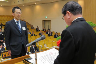 A student receiving a diploma from the President